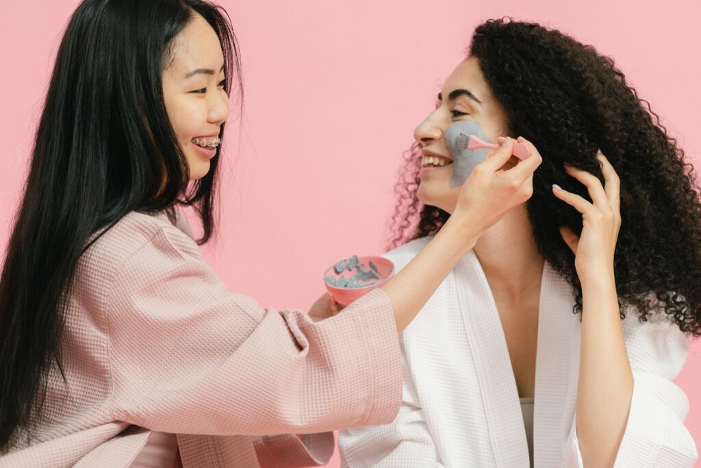pexels-photo-9775015-9775015 Two women having fun applying face masks and enjoying a skincare routine together.